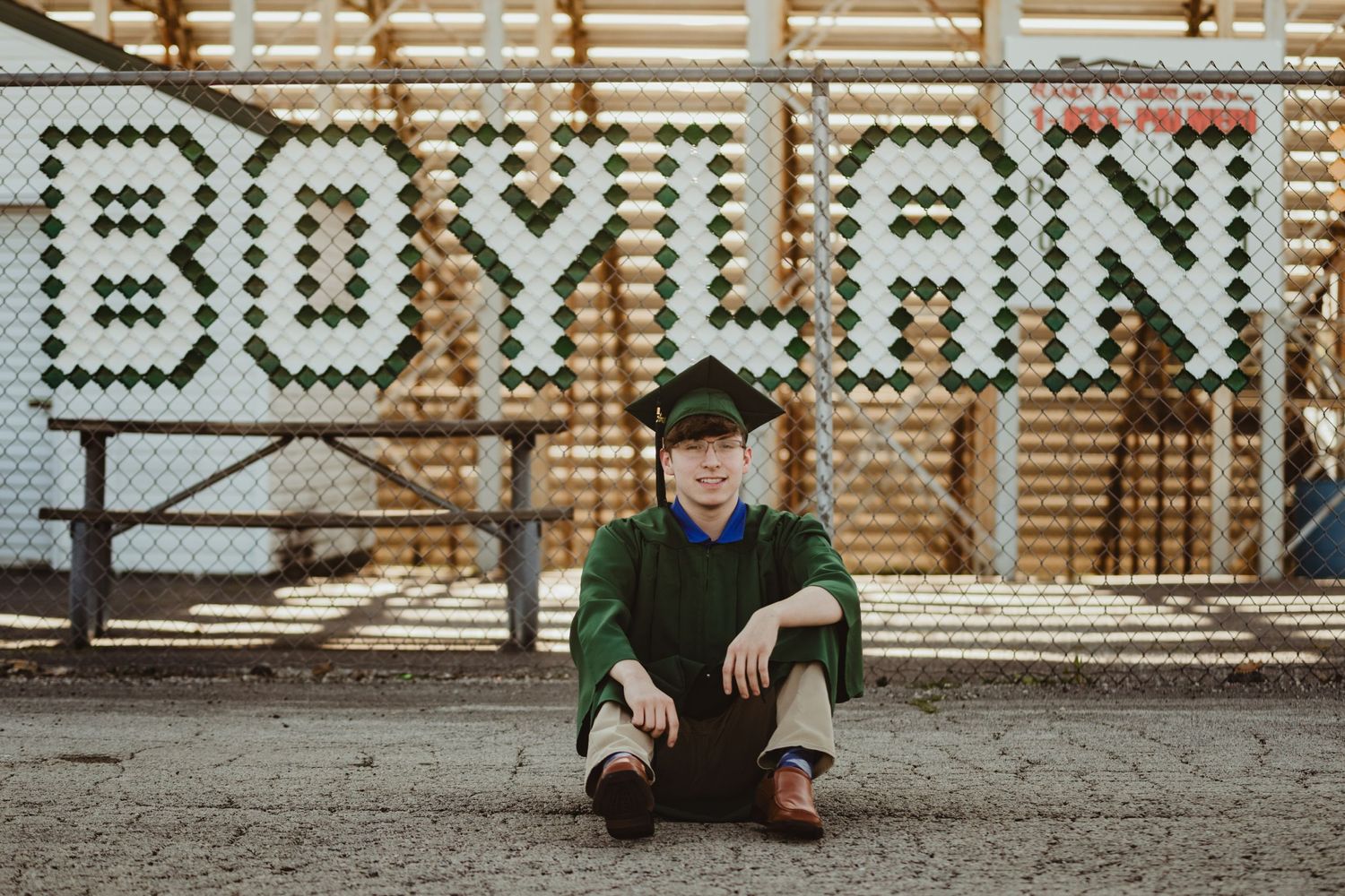 Artistic lettering spelling out 'Pavilion Boylan' on a rustic wooden wall.