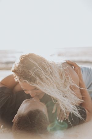 Dreamy beach photography with couple in soft natural light.