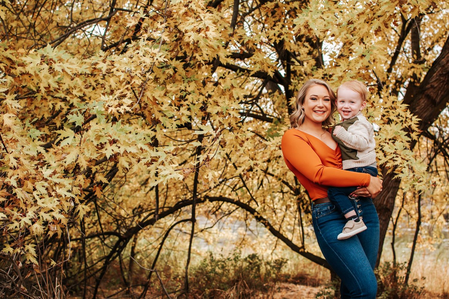 Joyful fall portrait among golden leaves at Chamna Natural Preserve in Richland, Washington.