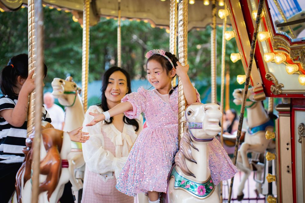 Fun girls birthday party photography on amusement rides at Rainbows End Auckland, captured by Imagine Image Studio.