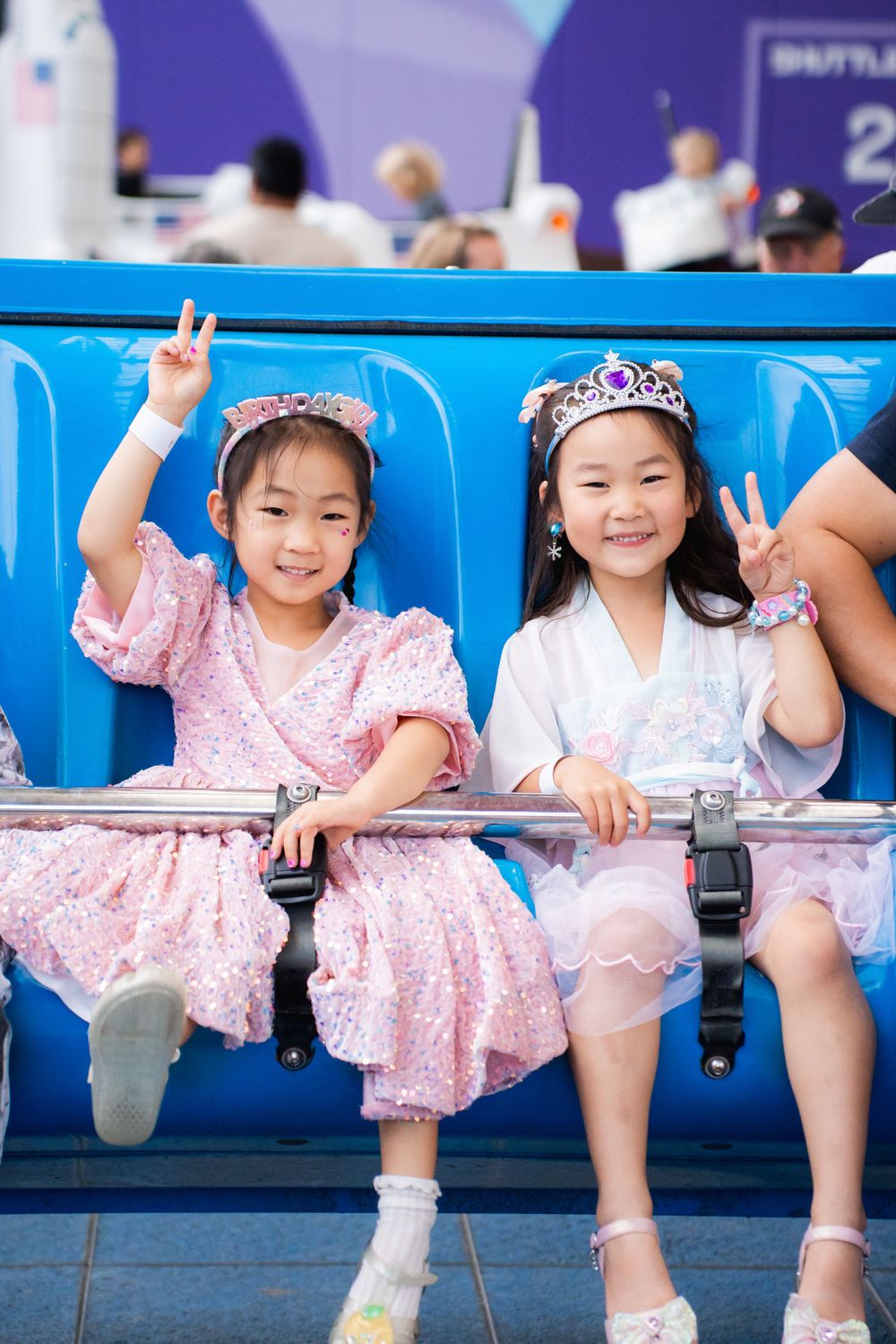 Fun girls birthday party photography on amusement rides at Rainbows End Auckland, captured by Imagine Image Studio.