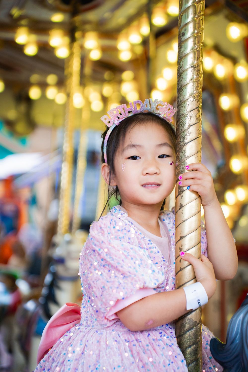 Fun girls birthday party photography on amusement rides at Rainbows End Auckland, captured by Imagine Image Studio.