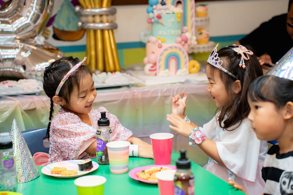 Fun girls birthday party photography on amusement rides at Rainbows End Auckland, captured by Imagine Image Studio.