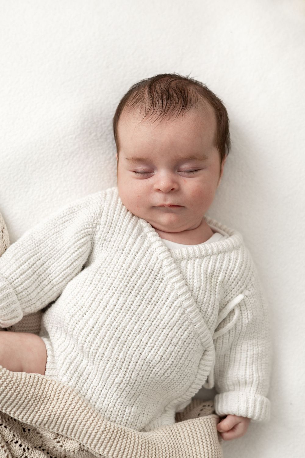 Baby photographer Nottingham newborn session neutral styling cosy home studio