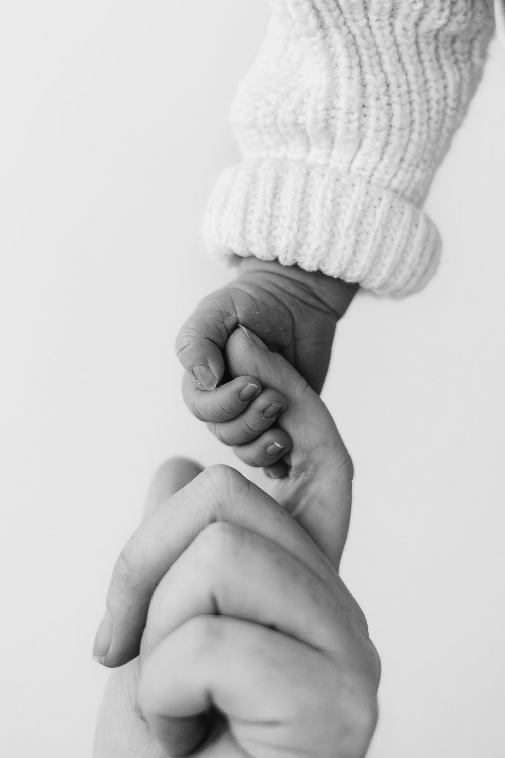 Newborn photography Nottingham baby close up tiny newborn hand holding new mums finger detail shot
