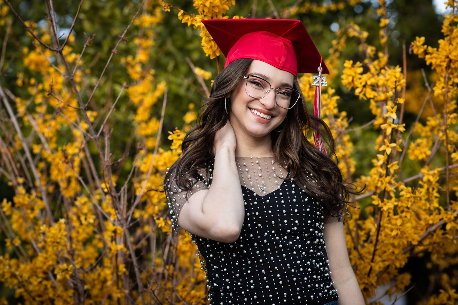 Beautiful senior portrait photography; graduate in graduation cap in flowers; Clarissa Anello