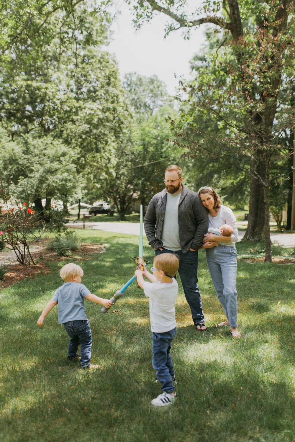 having fun during Knoxville lifestyle newborn photos taken at home