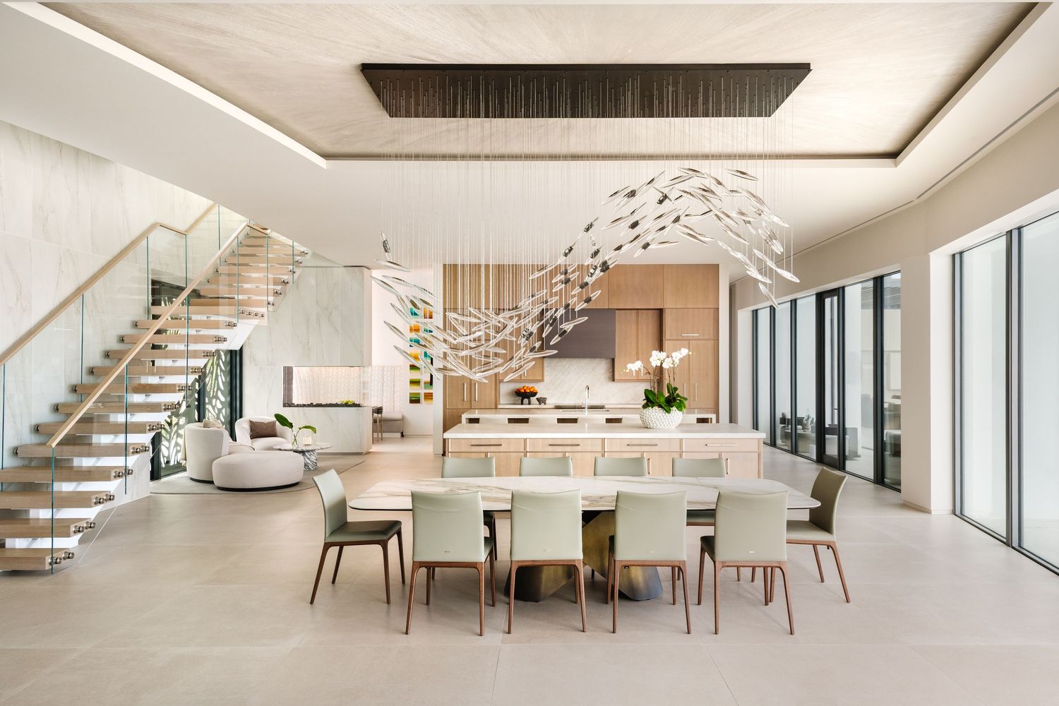 large dining and kitchen area with abstract chandelier