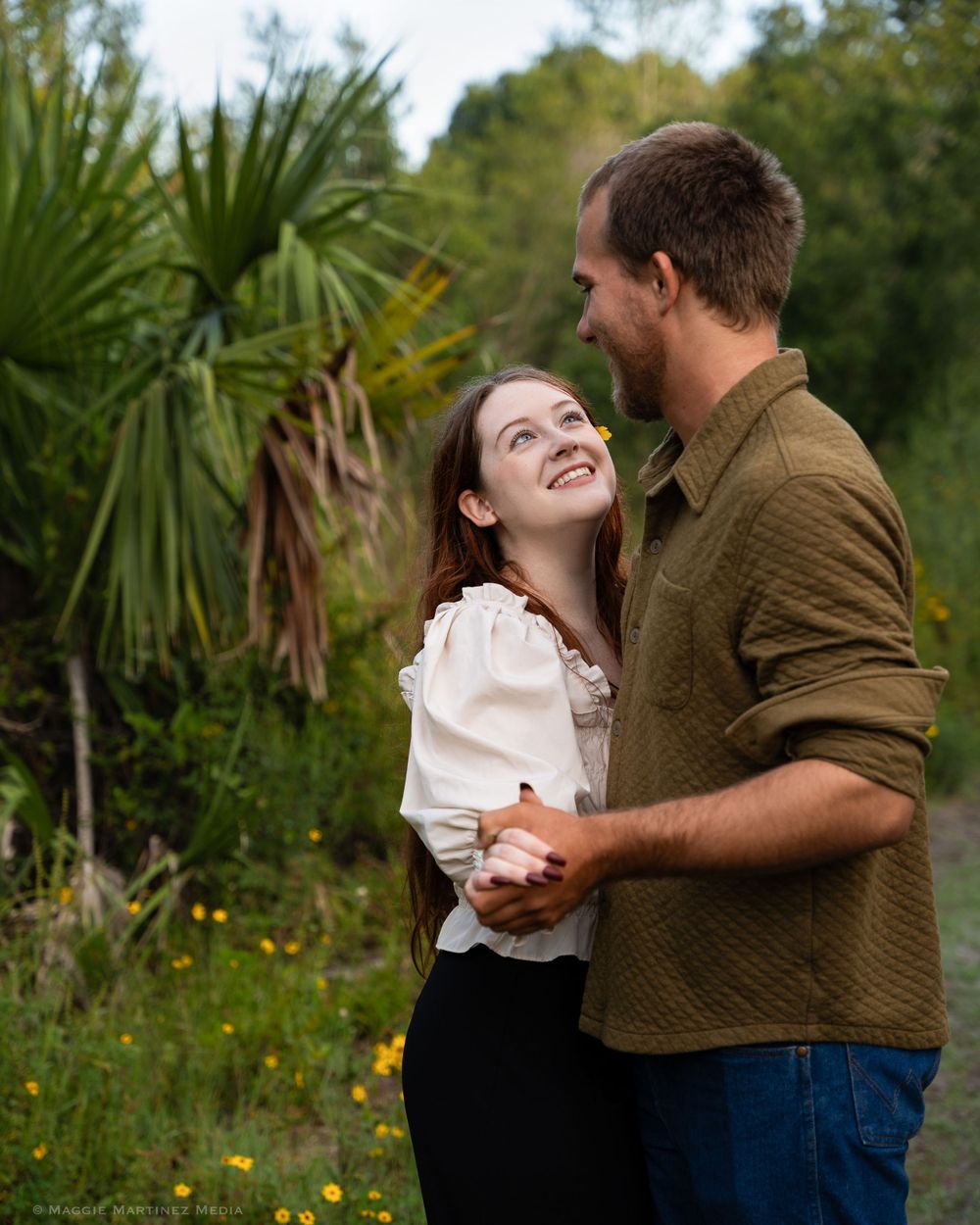 A couple poses for engagement photoshoot photography session in South Florida