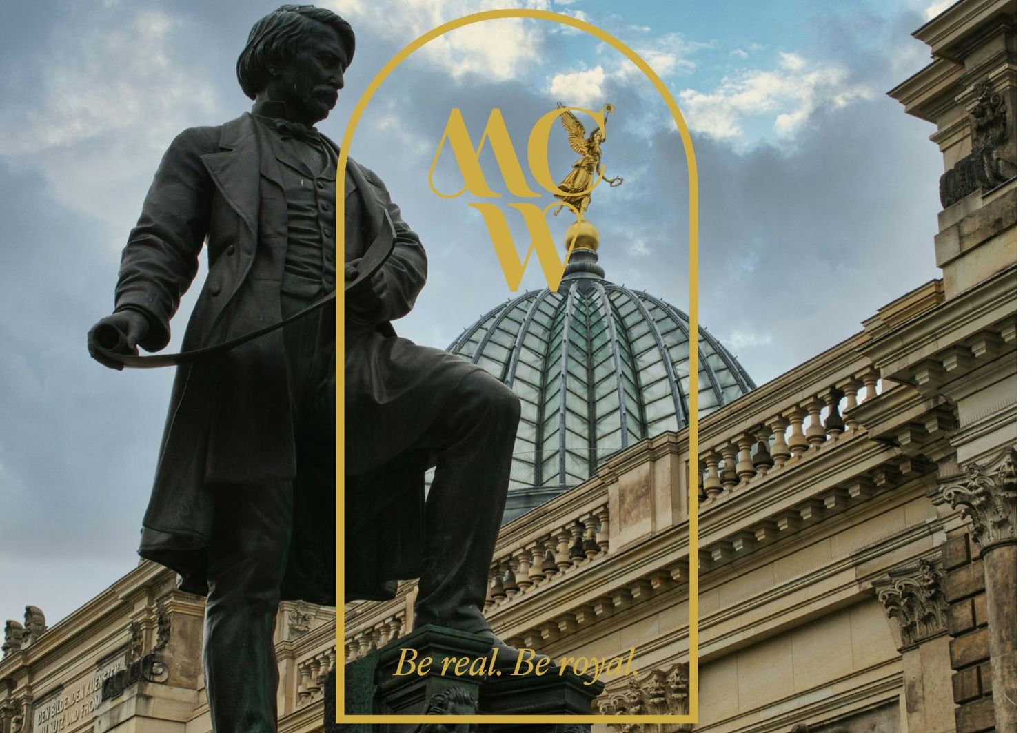 Historic statue and domed building with MCW monogram in gold arch frame.