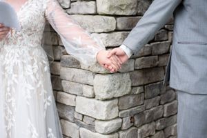 Wedding couple holding hands before the ceremony in Princeton, Kentucky