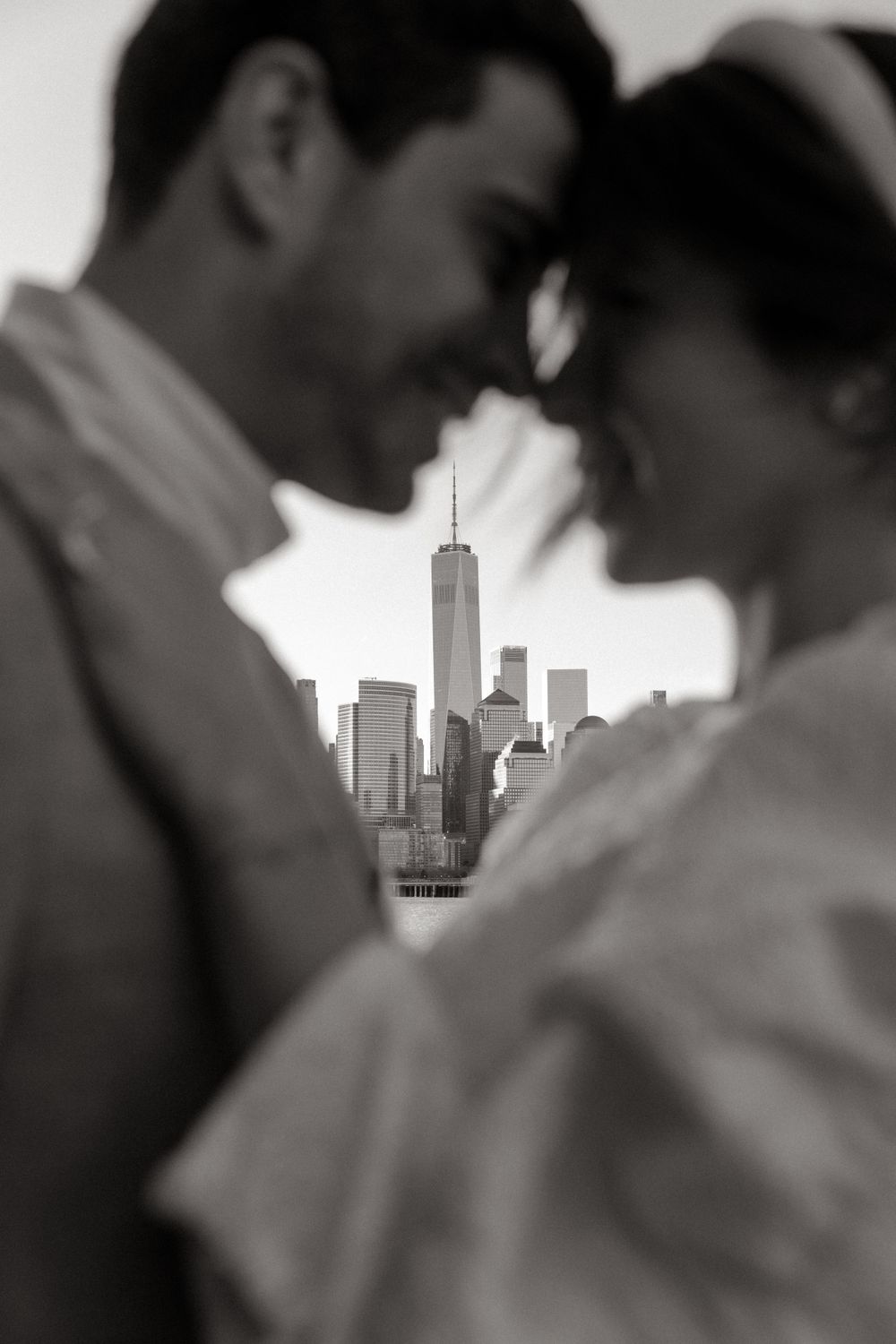 Romantic black and white portrait with One World Trade Center perfectly framed between couple.