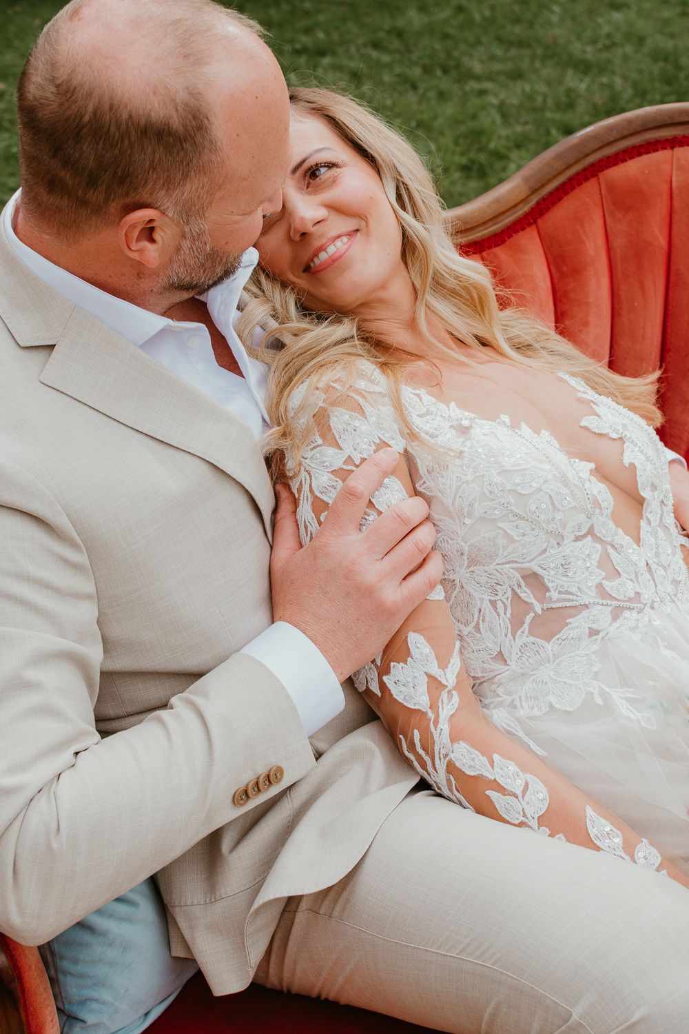 Close-up wedding photos showing details of lace dress and tender moments.