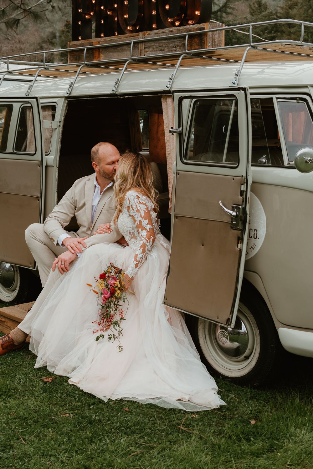 Series of wedding photos featuring couple by vintage VW van with string lights.