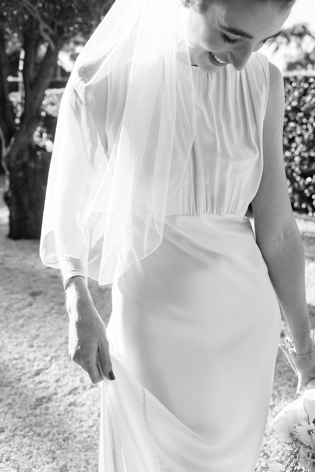 A candid black and white moment of laughter between a couple during their engagement session.