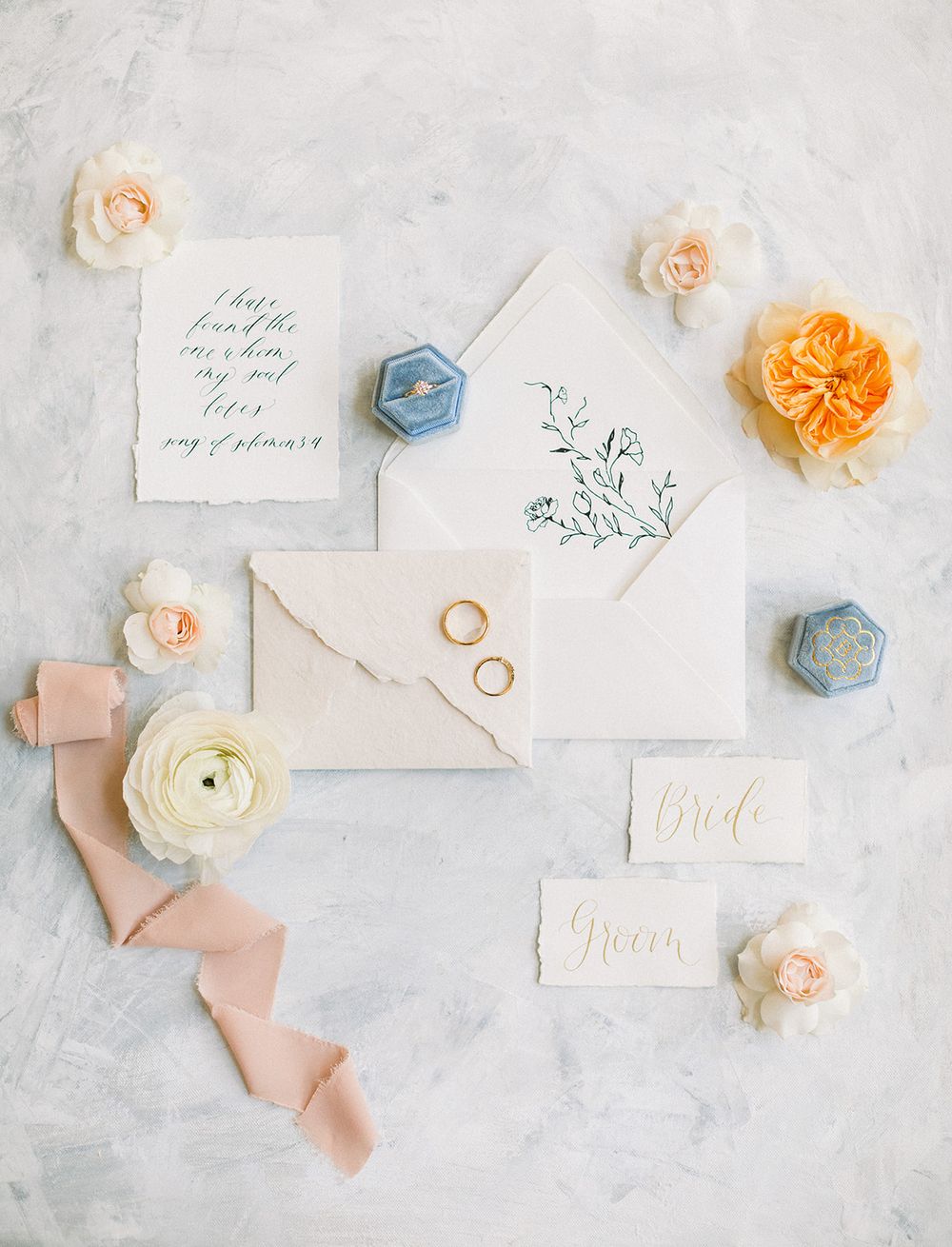 Timeless wedding flat lay captured on film. Fine art  film. Wedding details. Blush, blue and orange florals