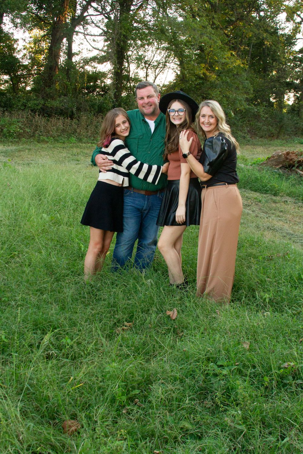 A family with two teen daughters on a fall day in Manila, Arkansas, by Delta Blossoms Photography