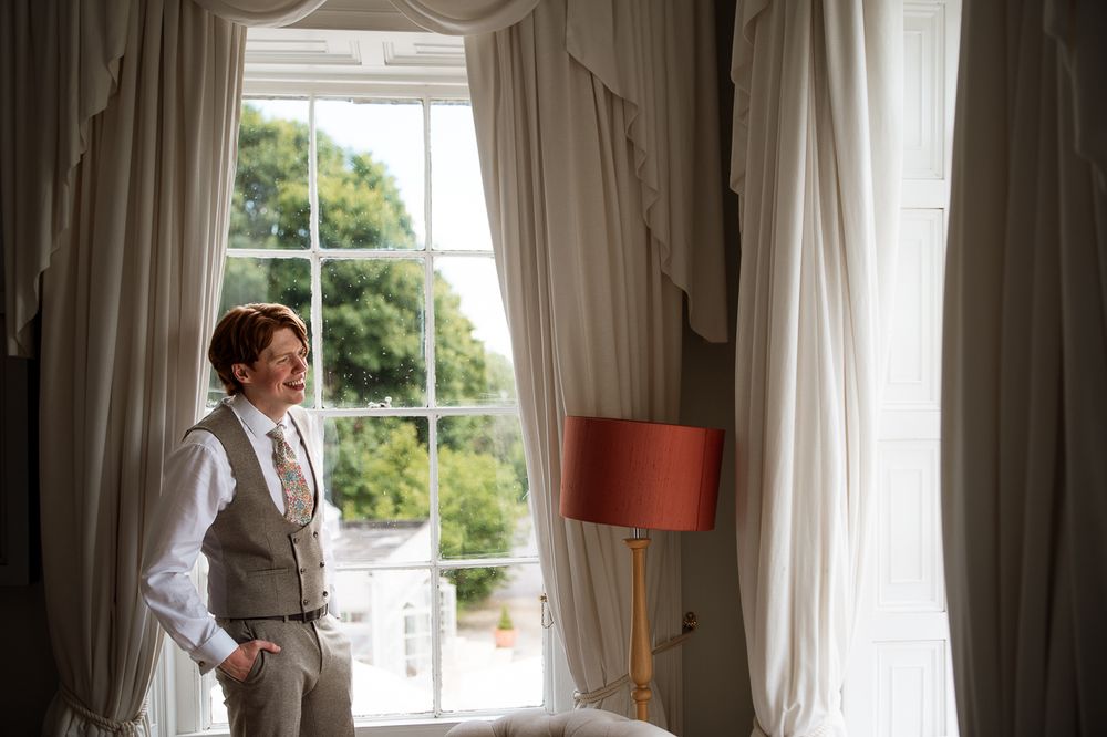 Bright interior room with white curtains and natural window light.
