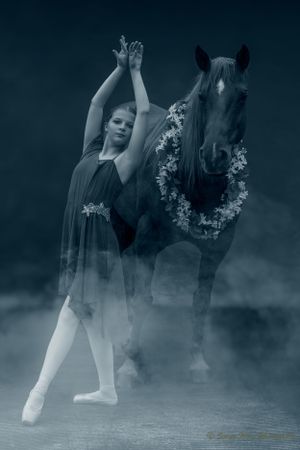 Artistic ballet pose with dancer and horse adorned in floral wreath in ethereal misty setting. Sonya Helm Equine Photography, Bristol, TN