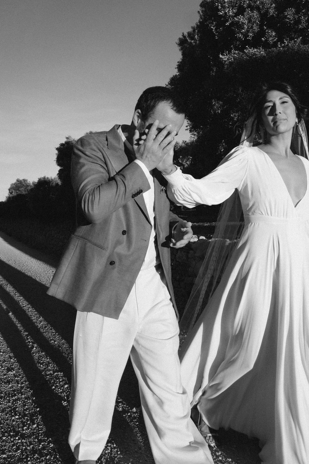Bride and groom sharing a candid moment at their destination wedding in Puglia, Italy, photographed by Alice Santella.