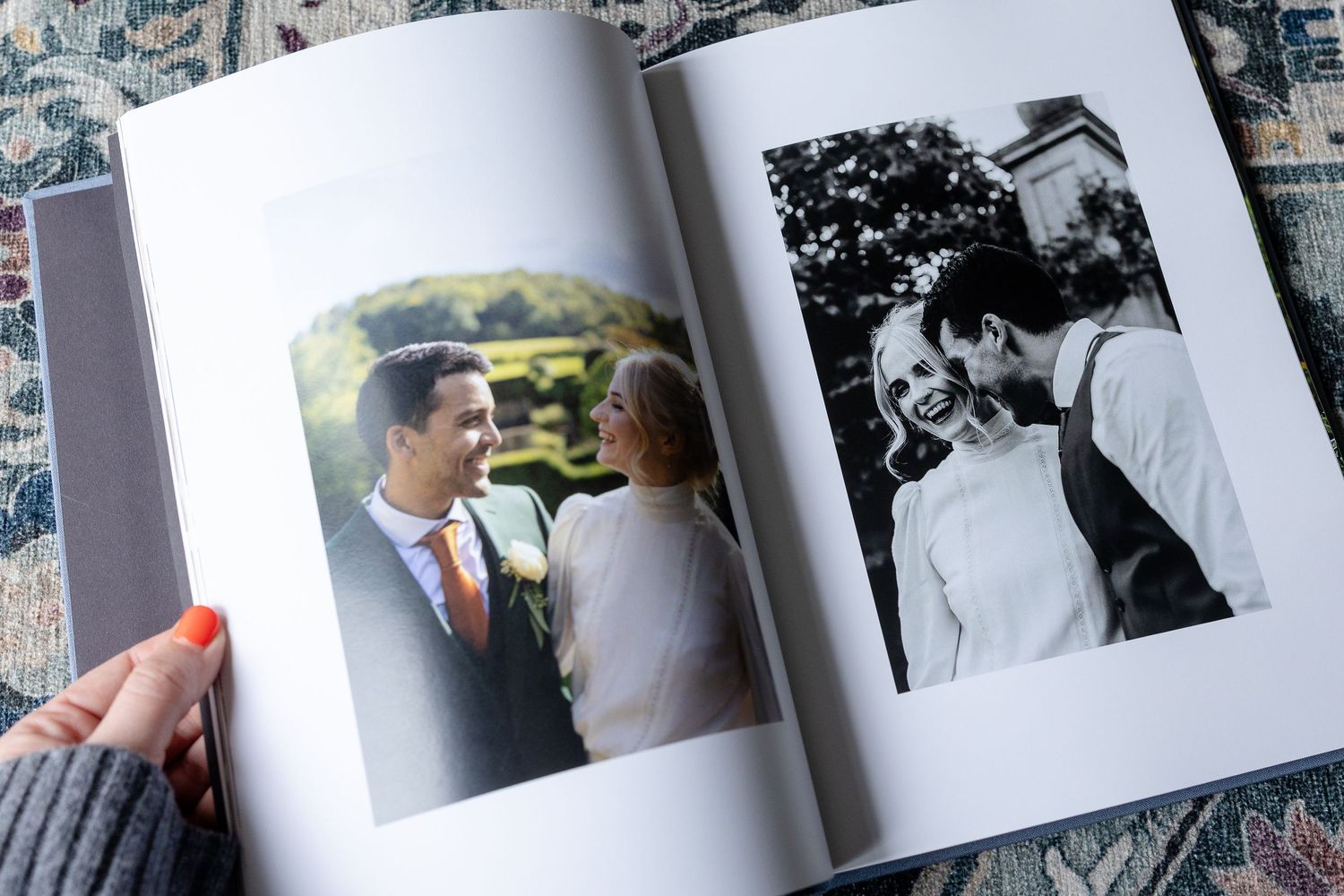 Wedding photo album spread showing ceremony and reception moments with pearl decoration.