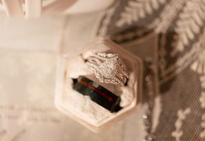 Close-up macro photo of a white USB connector showing hexagonal shape and internal metal contacts.