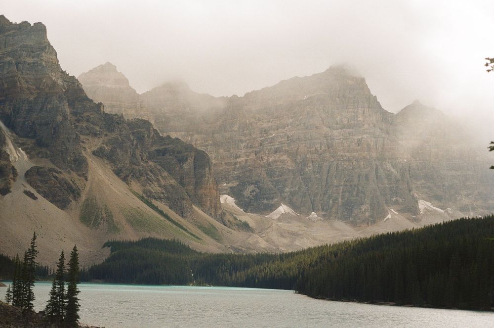 Shot of Moraine Lake on film with the fog rolling in over the mountains