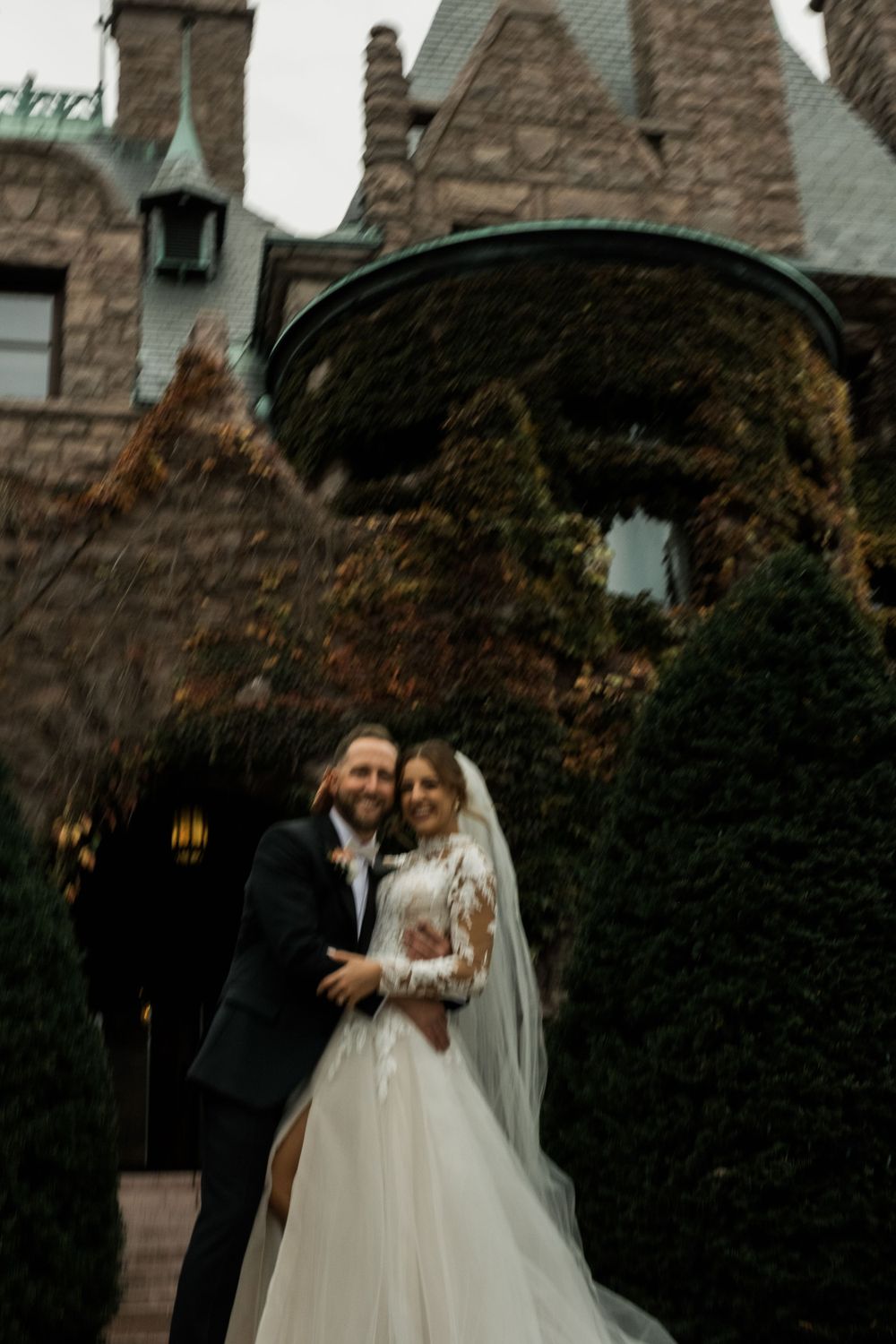 Shot of couple on their wedding day in front of the Van Dusen Mansion