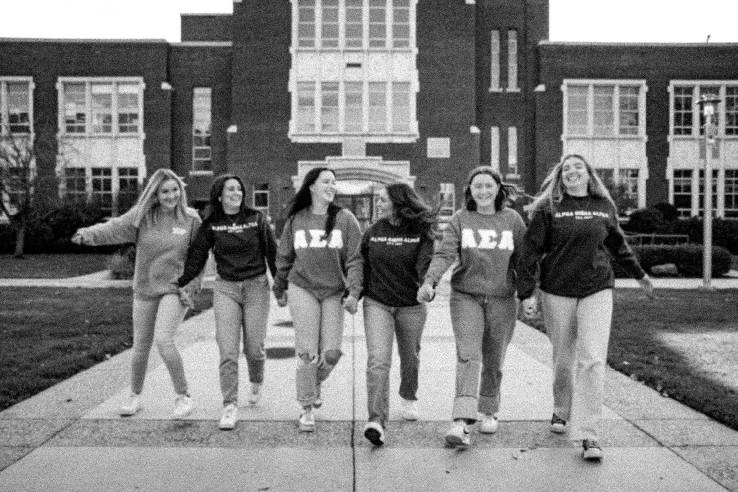 A group of girls walking hand in hand