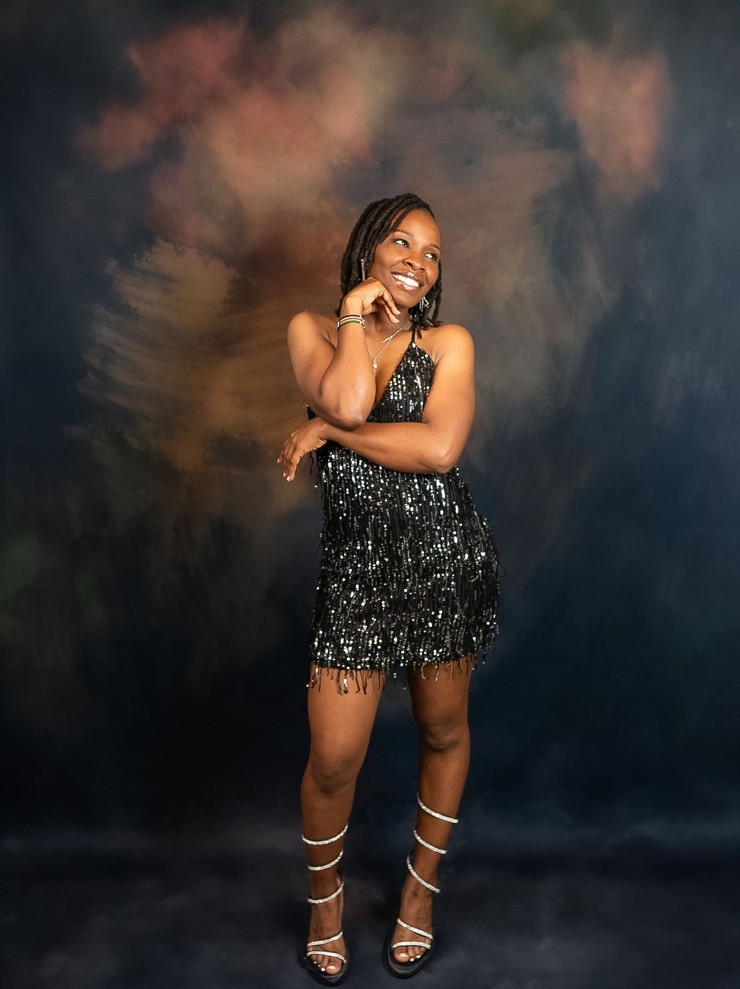 Artistic portrait series showing expressive poses in a sparkly outfit against a dark moody backdrop.