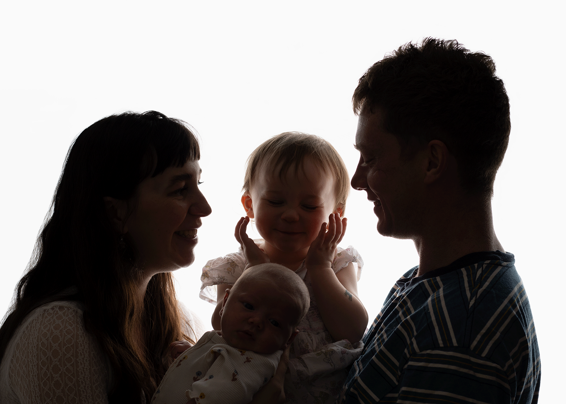 Family portrait including mum, dad and two siblings, during a newborn session in Ceredigion