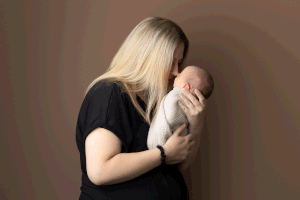 Mother and baby bond captured at in-home newborn session with Ceris Hicks Photography, newborn sessions based in Ceredigion