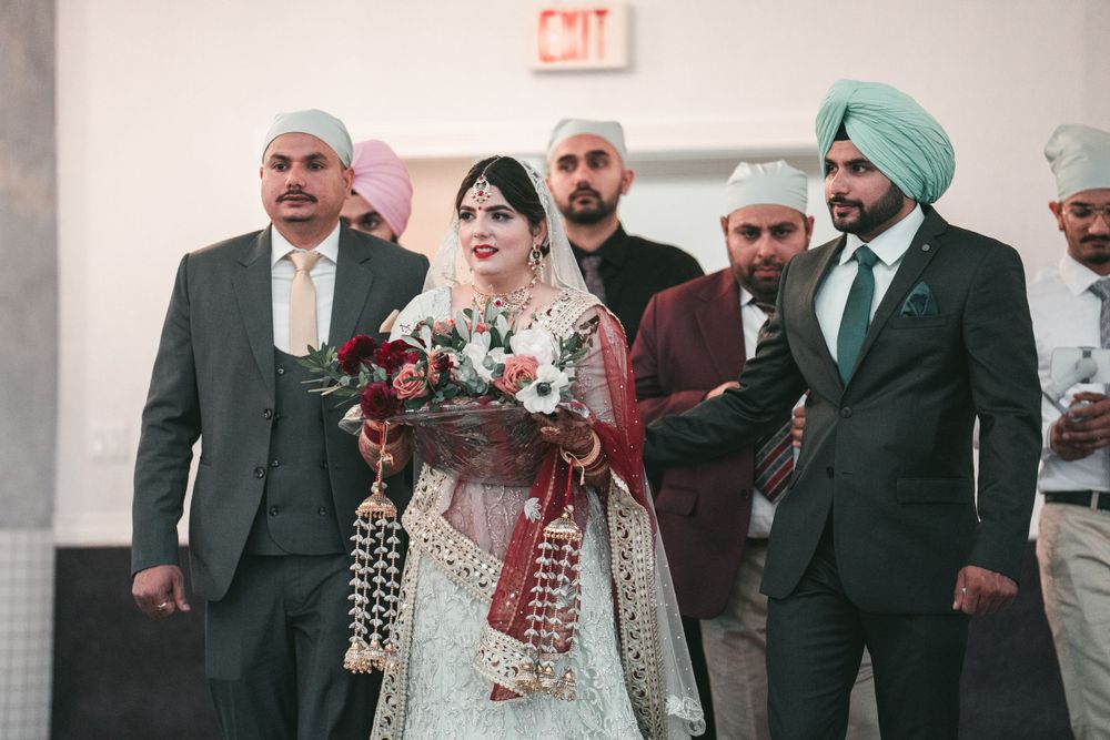 Wedding party in traditional Indian and Western attire during ceremony.
