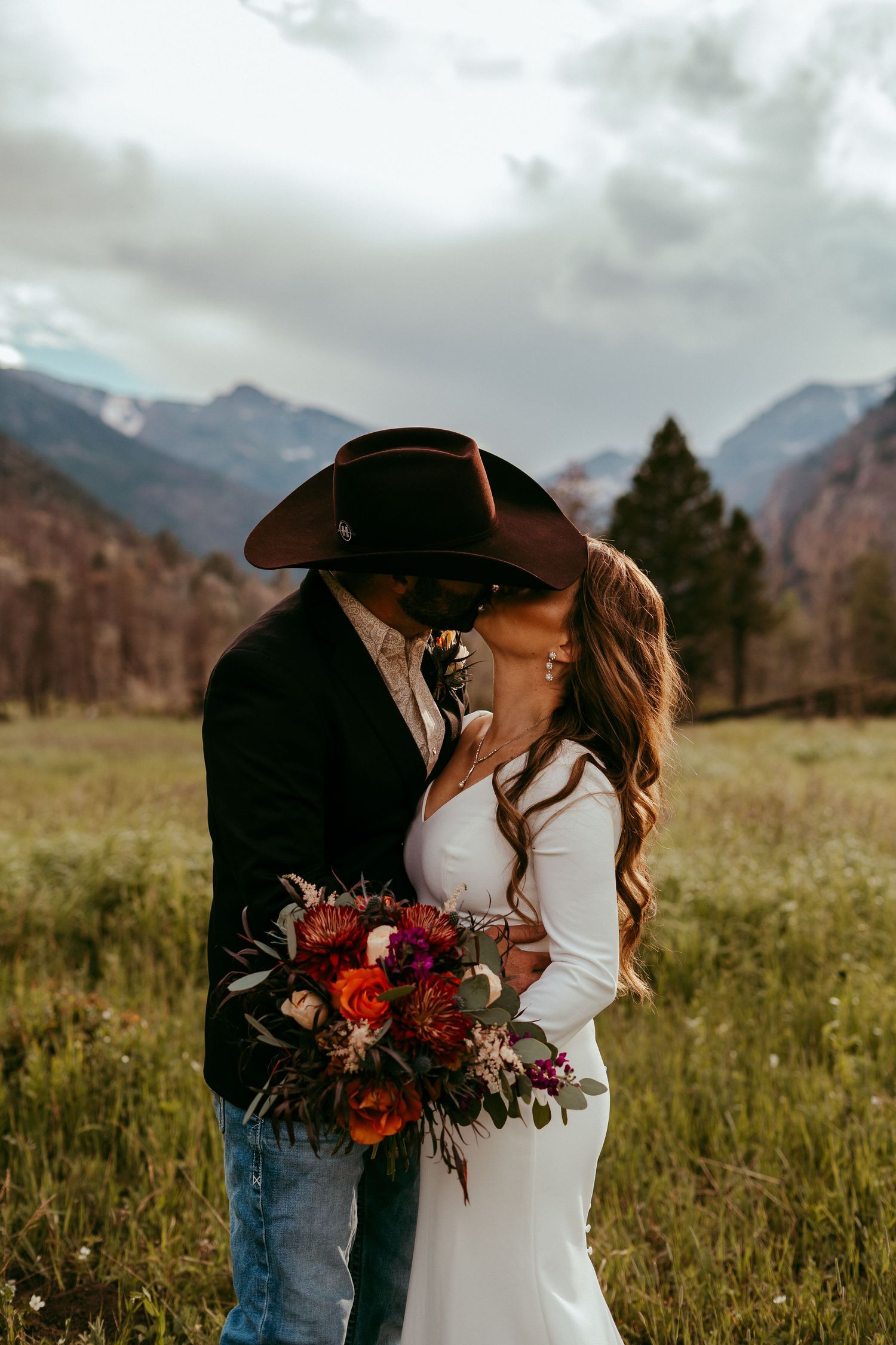 Outdoor wedding ceremony in Wyoming with mountain views and rustic charm