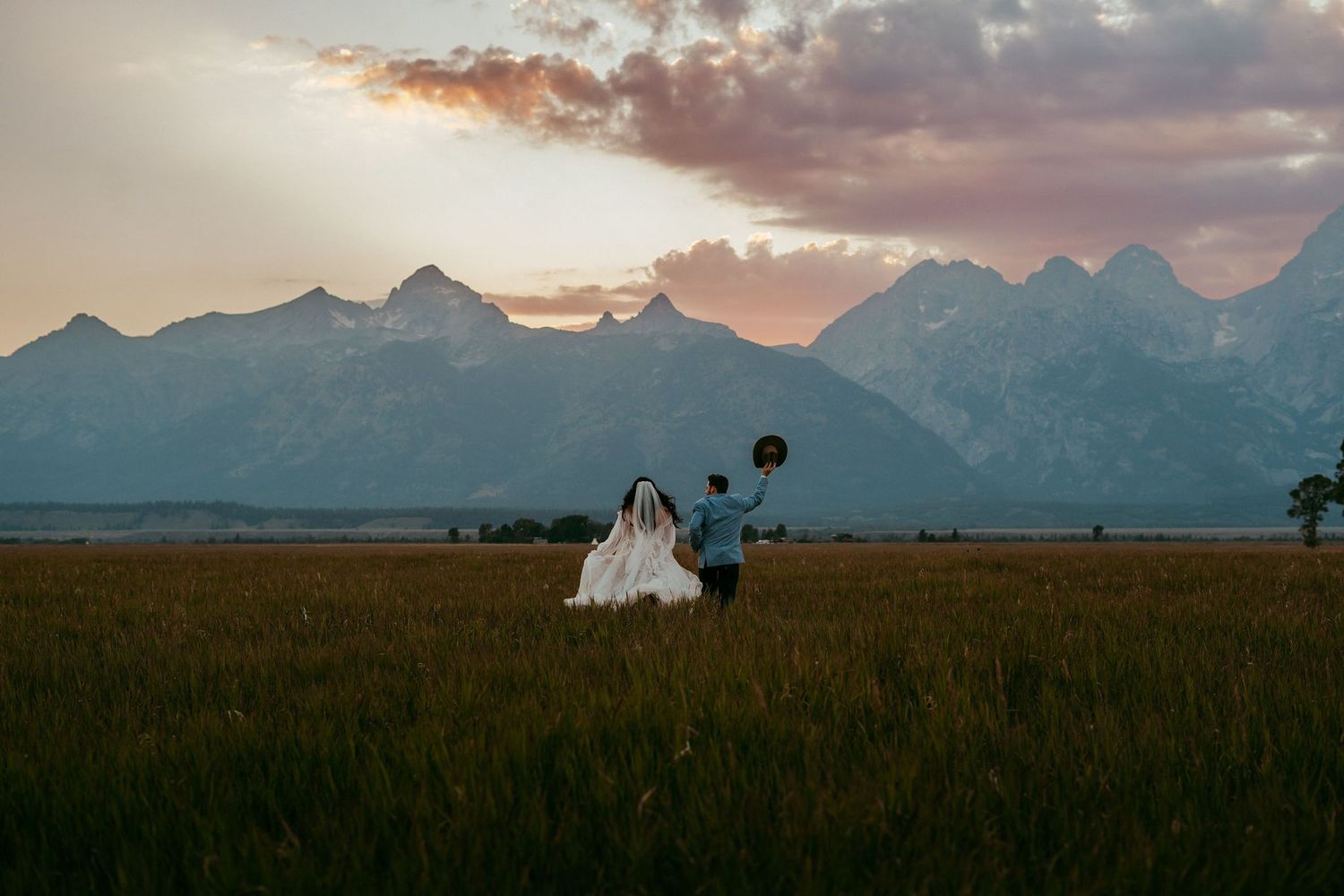 Outdoor wedding ceremony in Wyoming with mountain views and rustic charm