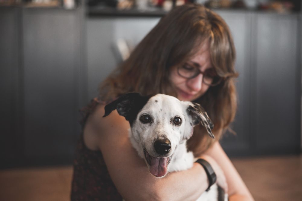 Jean and her dog Aoule cuddling