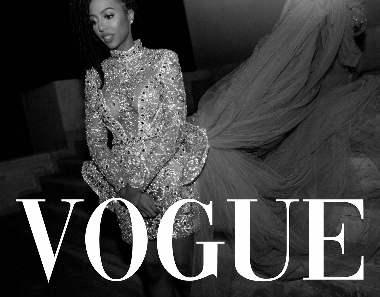 A glamorous fashion portrait in black and white with Vogue text overlay.