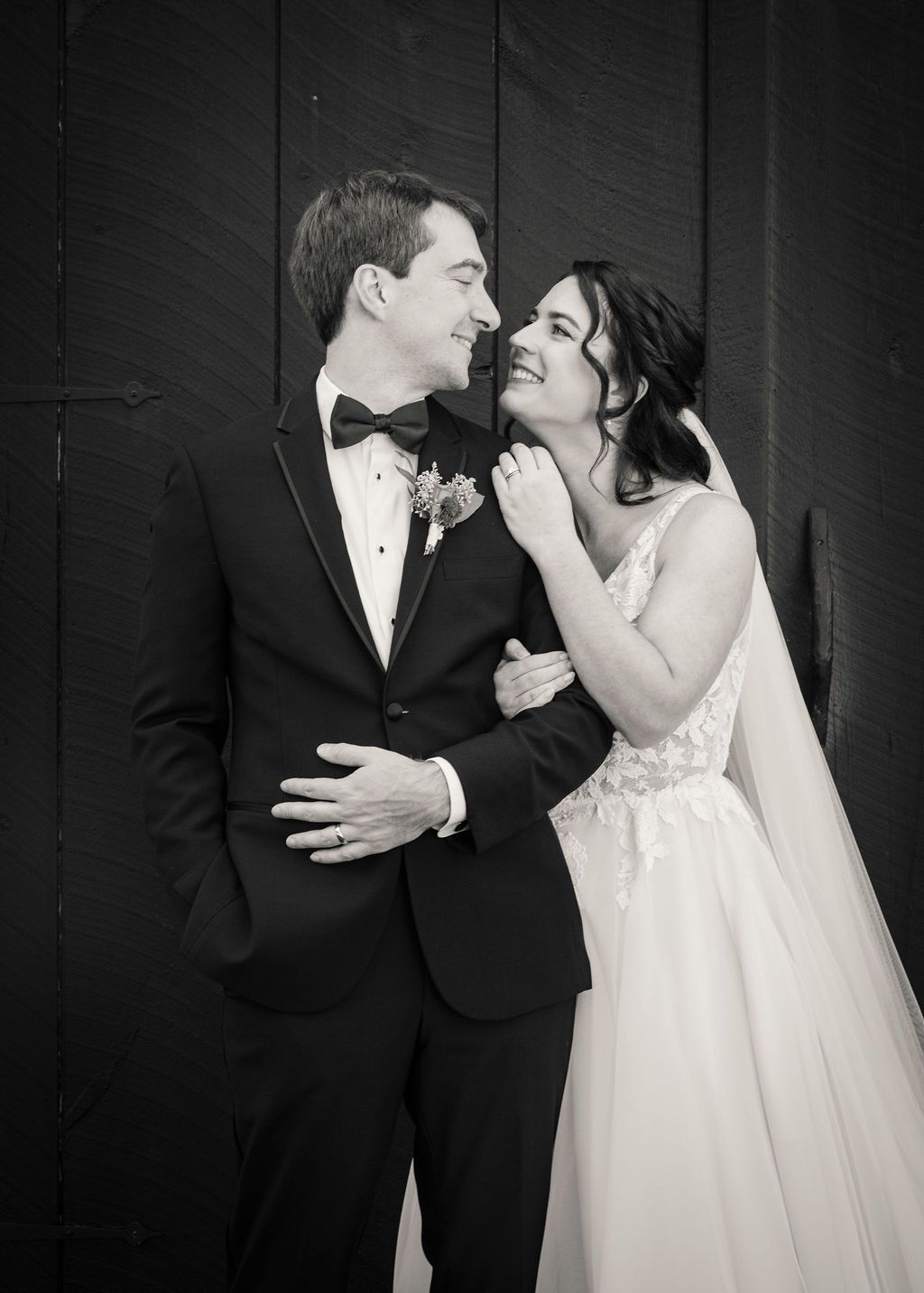 A series of black and white romantic wedding portraits showing tender moments between a bride and groom.