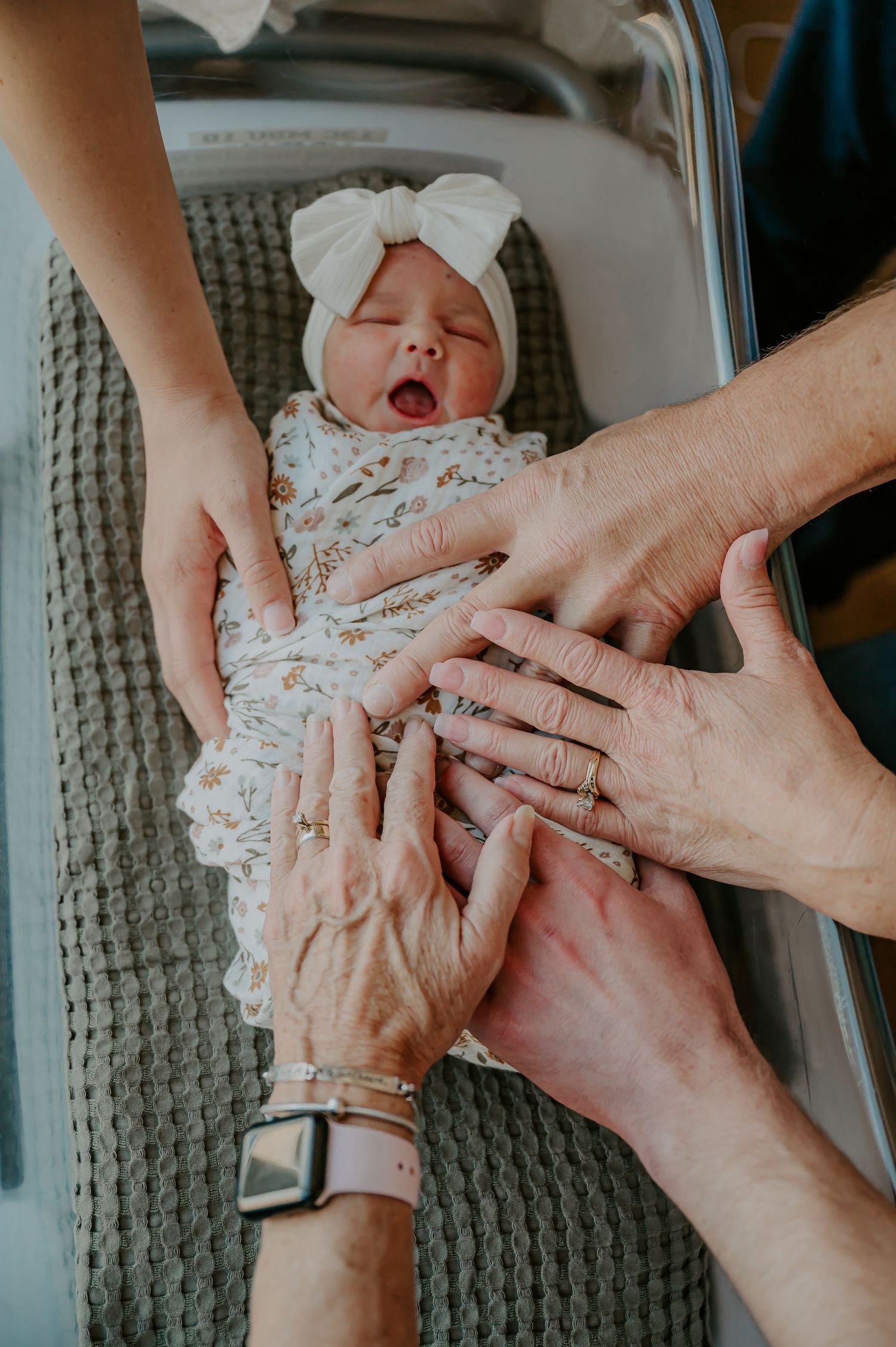 Newborn surrounded by family