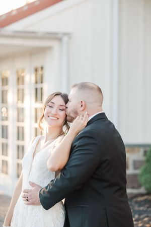 A joyful wedding couple shares intimate moments in a series of candid photos against a white building exterior.