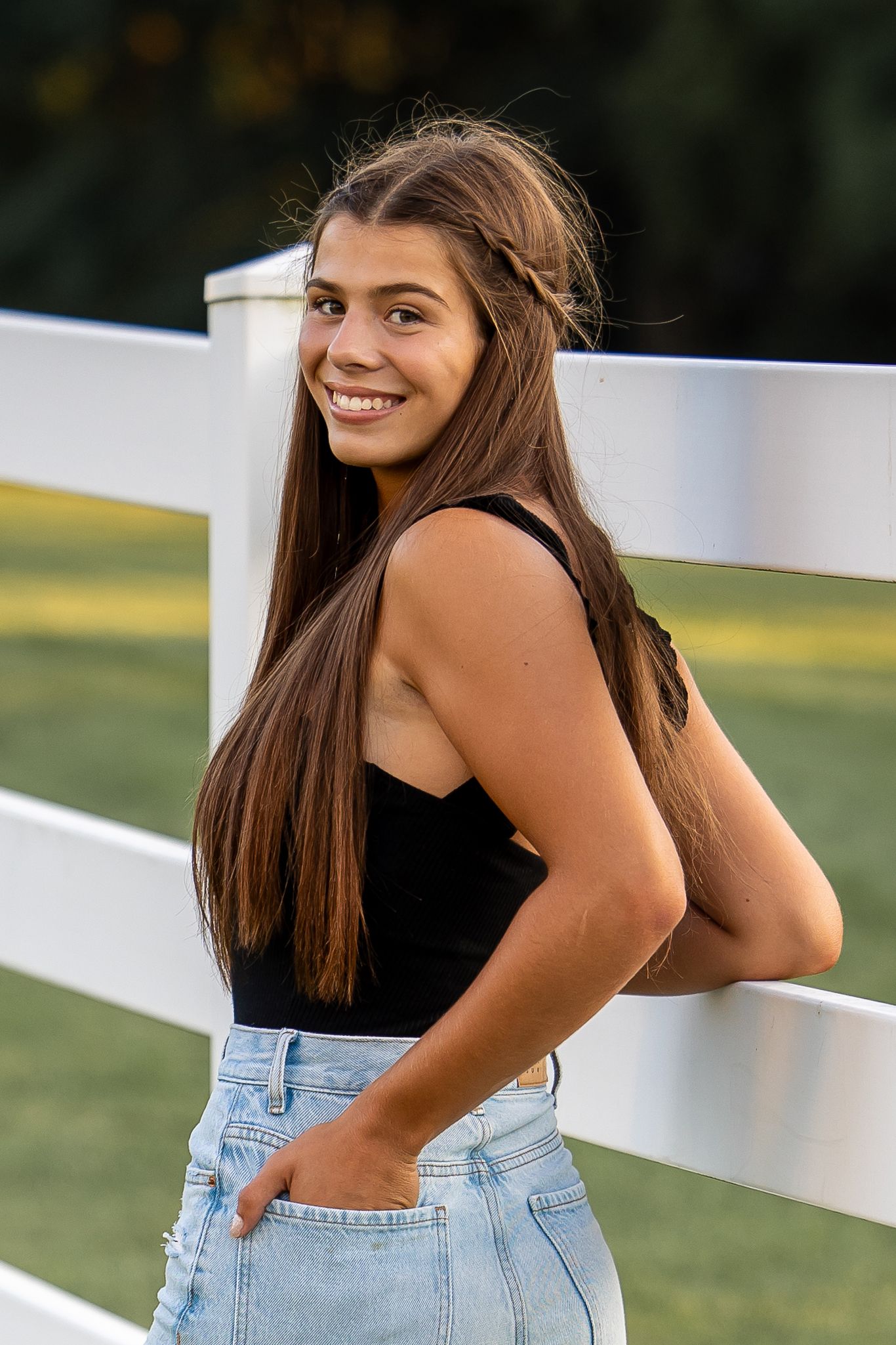 girl by a fence