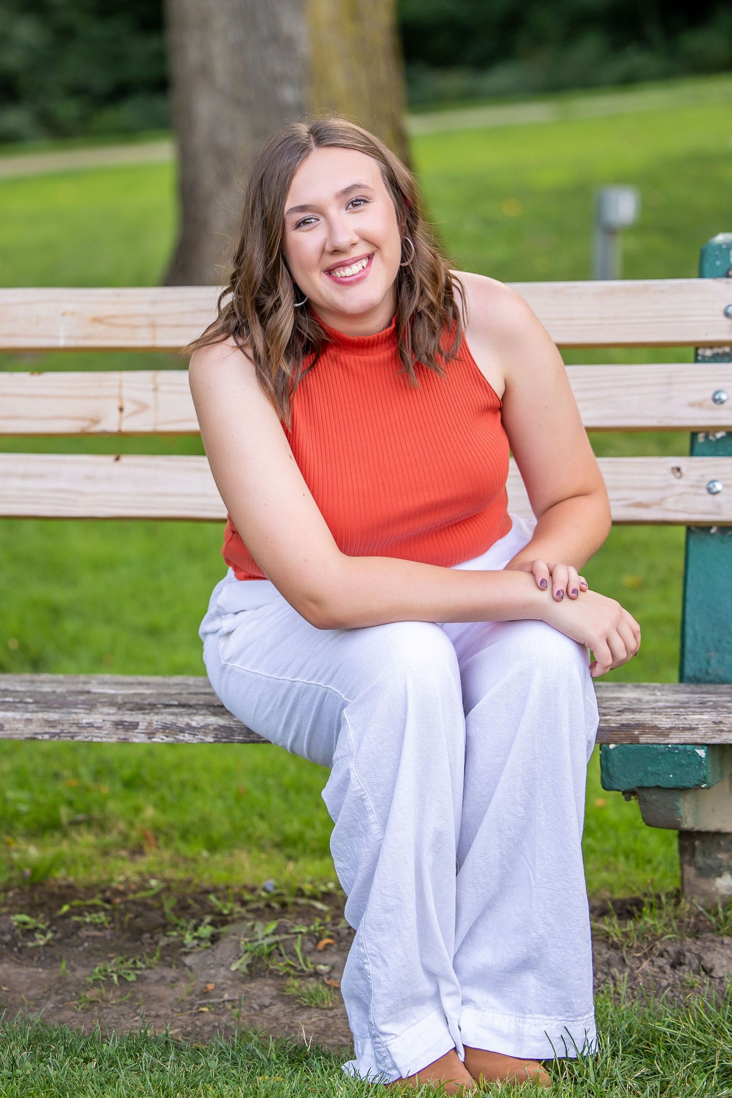 senior posing on bench
