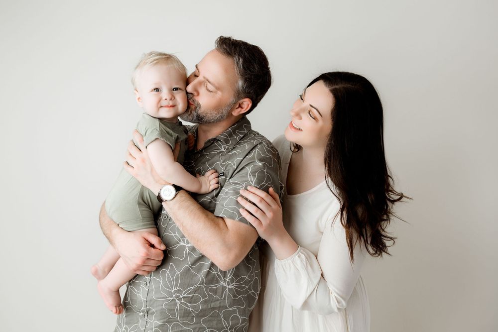 First Birthday family photo, smiling baby