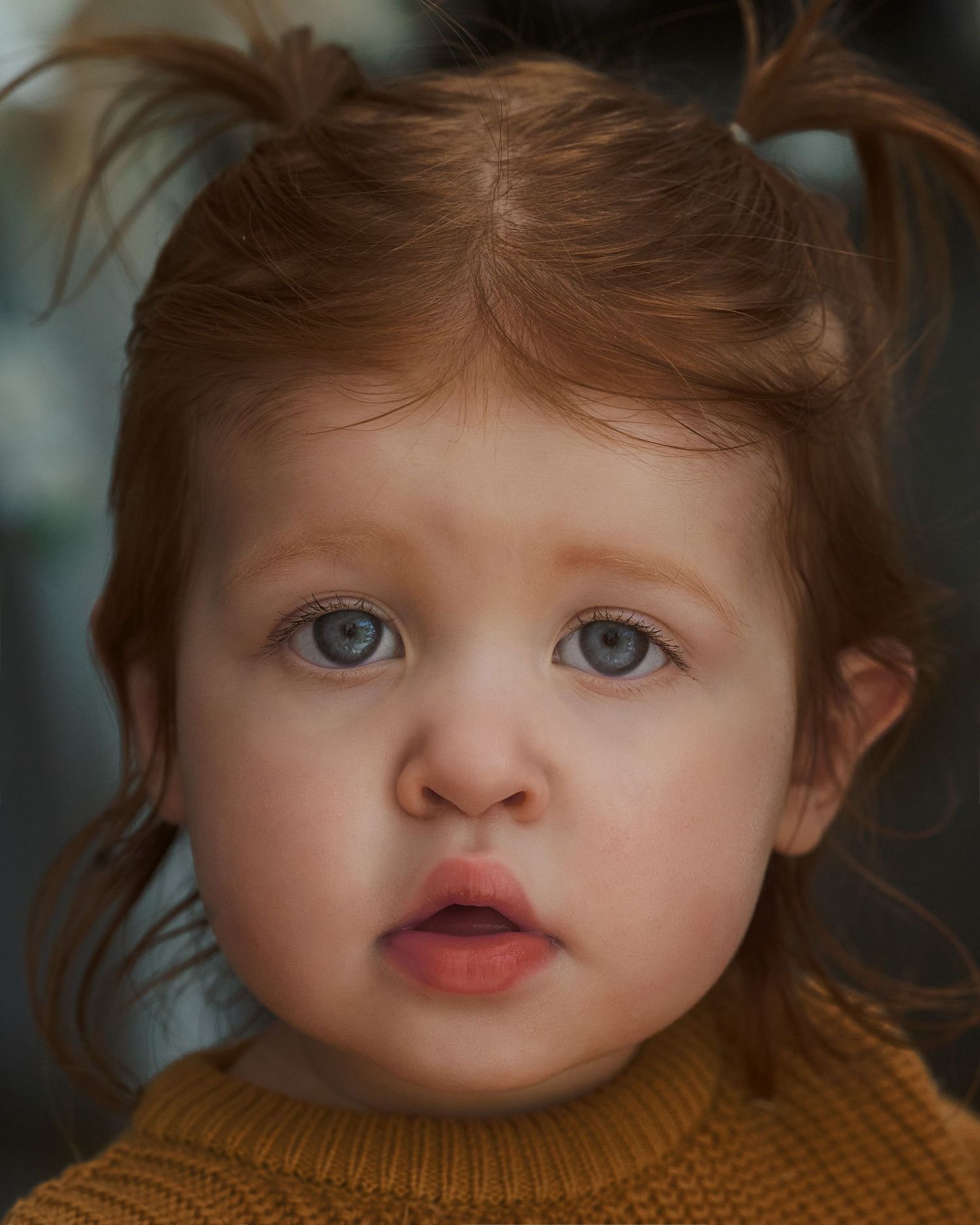 Close-up portrait with soft lighting highlighting delicate features.