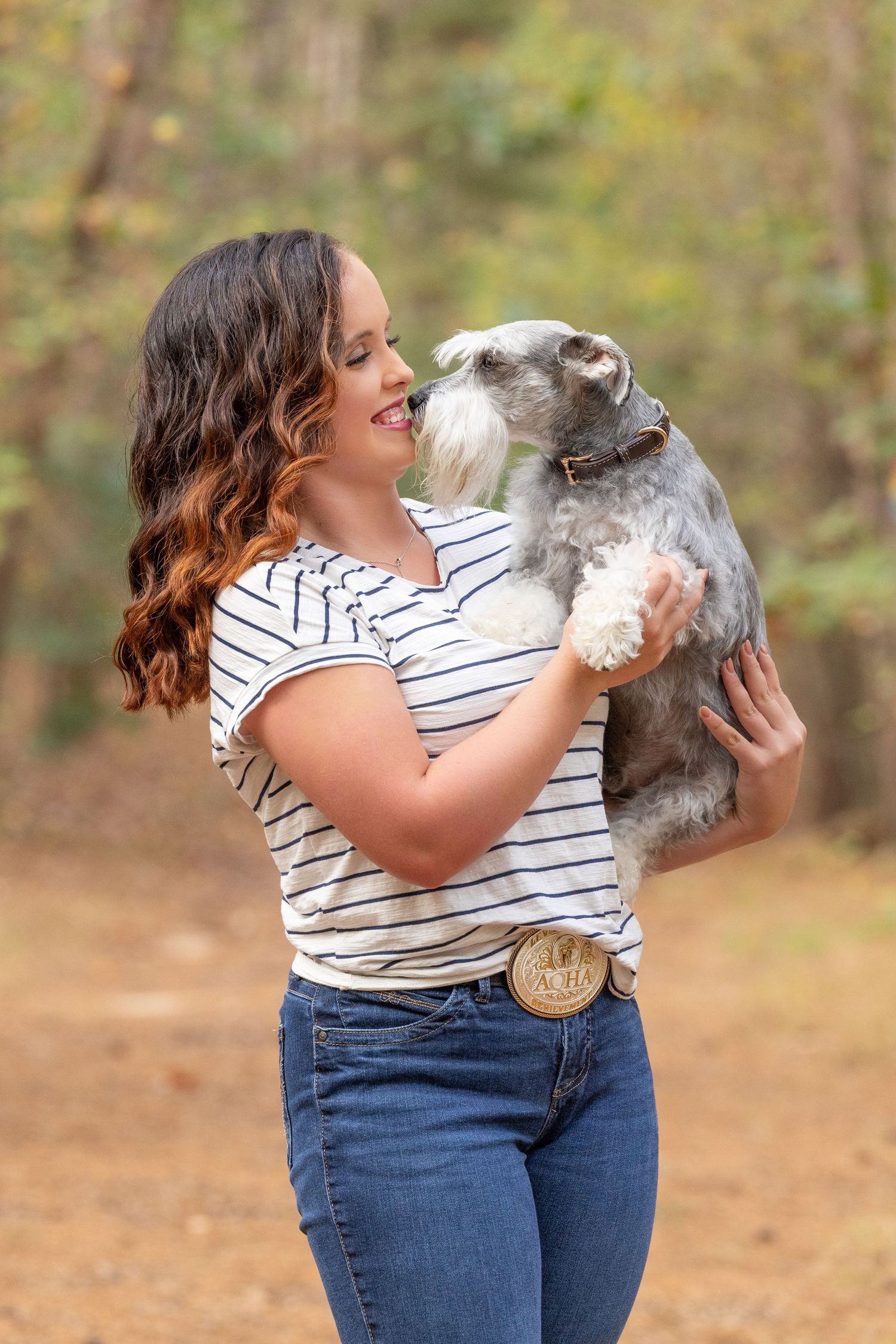 girl holding dog