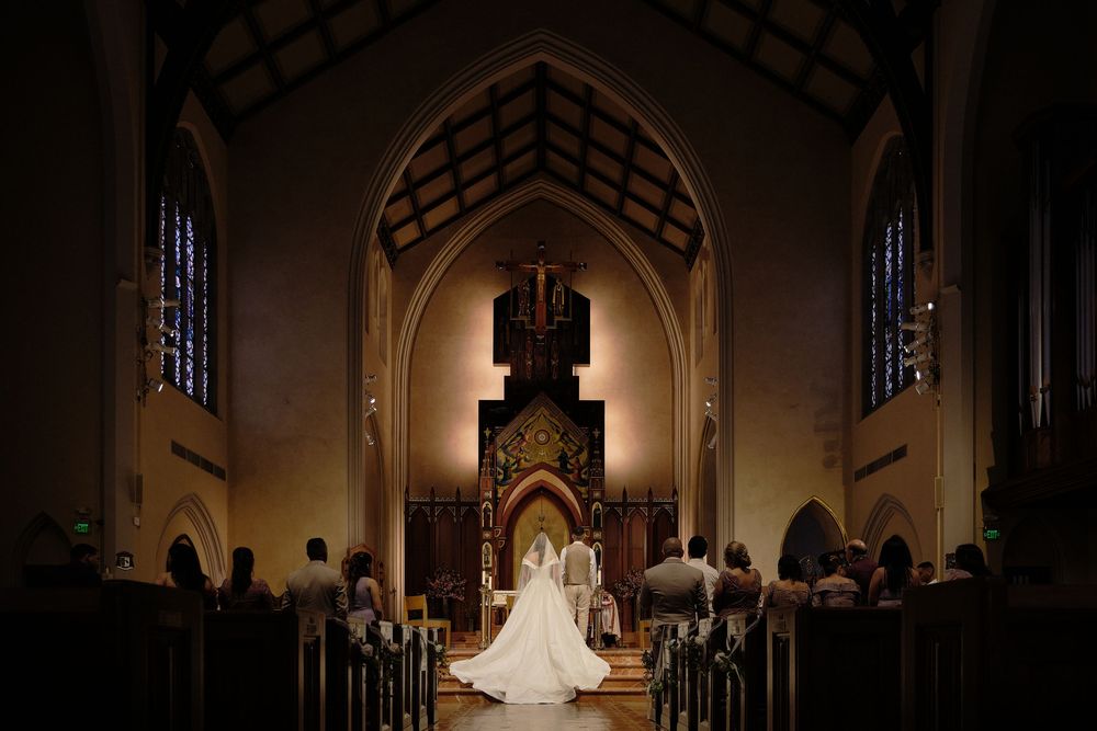 A sequence of wedding ceremony photos showing the bride walking down a dimly lit church aisle.