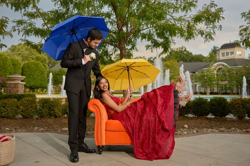A series of photos showing a couple posing with a bright red umbrella and flowing red fabric in an outdoor setting.