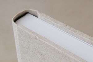 Three elongated rubber rollers with ridged surfaces lie parallel to each other on a textured gray surface.