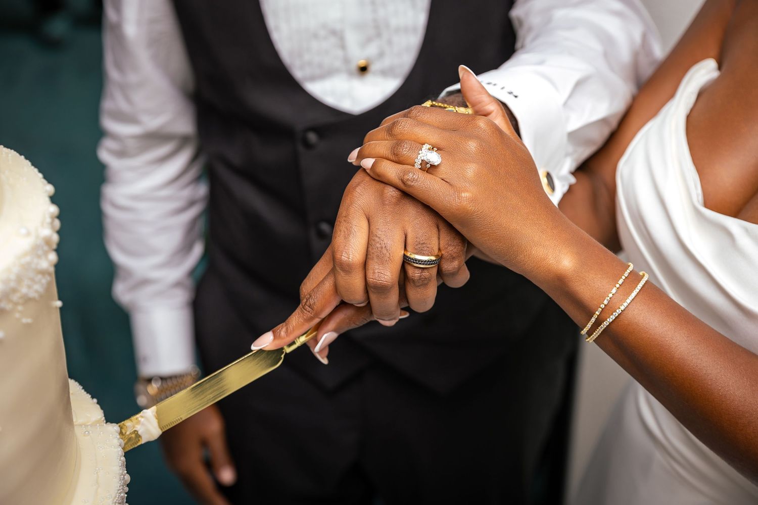 A series of hands wearing wedding rings and jewelry, shown in a collage of close-up shots.