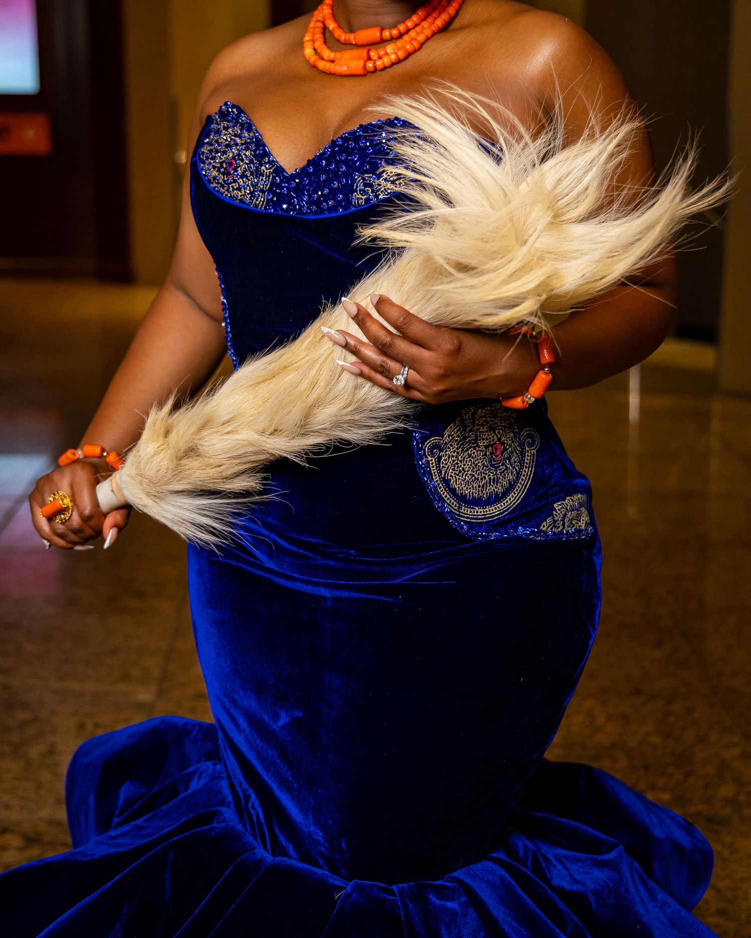 A sequence of dance movements in a royal blue velvet dress with flowing blonde hair captured in motion.